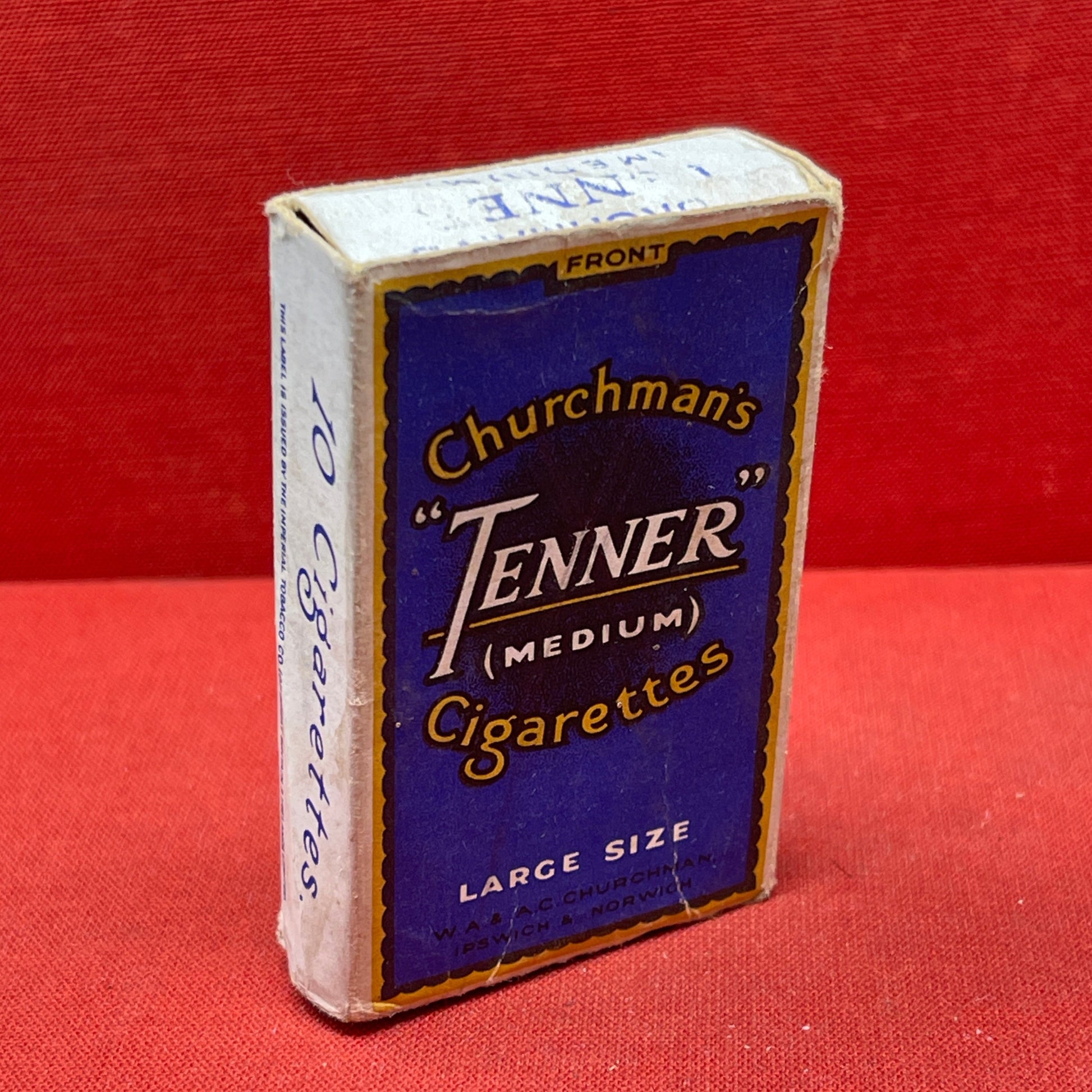 Cardboard cigarette packet consisting of a blue and black-printed sleeve and a cardboard drawer