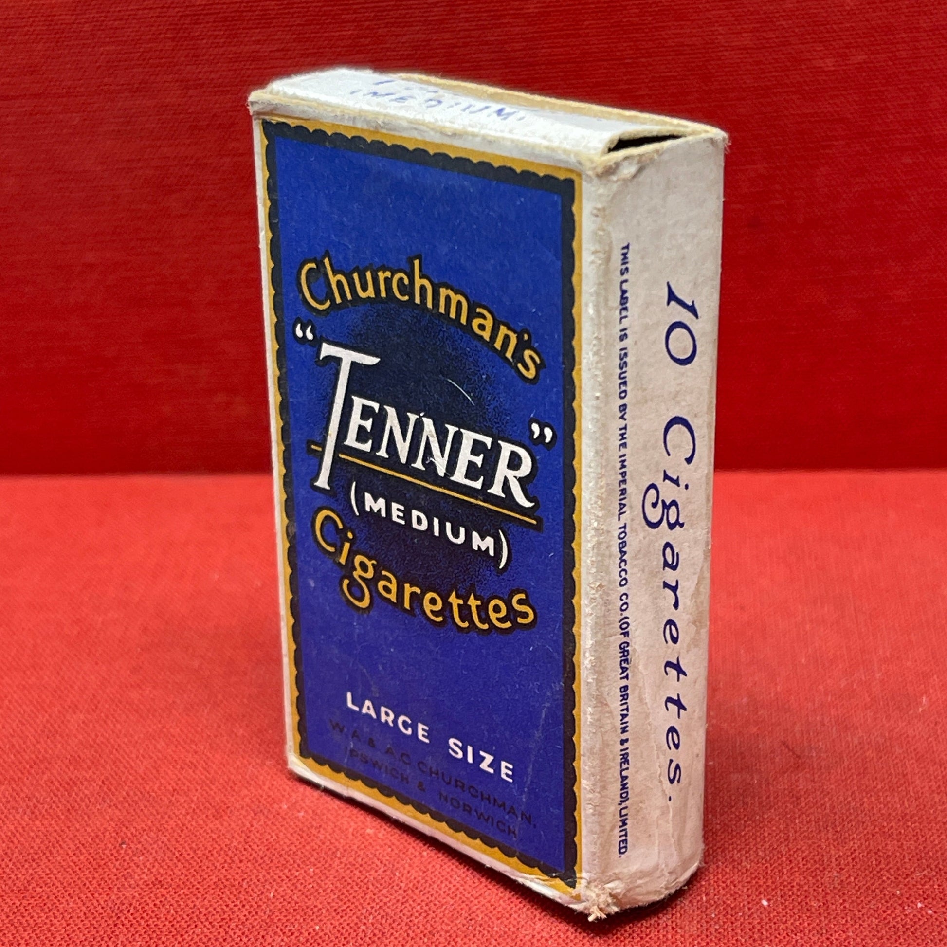 Cardboard cigarette packet consisting of a blue and black-printed sleeve and a cardboard drawer