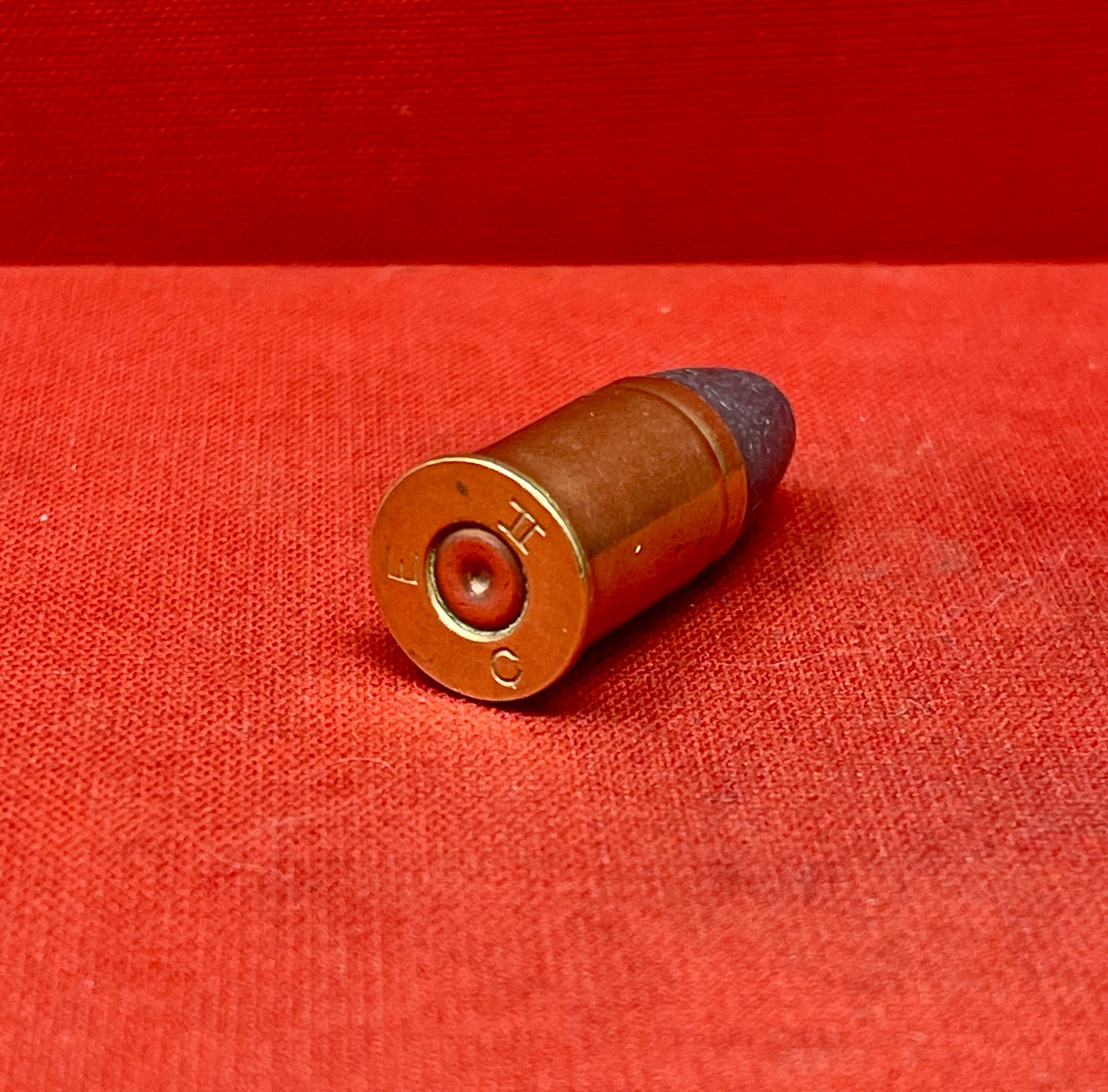 The .455 INERT British Wartime Round with the E C II headstamp is a highly detailed, safe-to-handle replica of a historical cartridge used during the early 20th century. This inert round is a non-functional reproduction, meaning it contains no live components such as primer, powder, or projectile, making it ideal for collectors, educators, or firearm enthusiasts who wish to study or display wartime ammunition without risk.

The .455 cartridge was widely used in both World Wars, particularly in revolvers lik