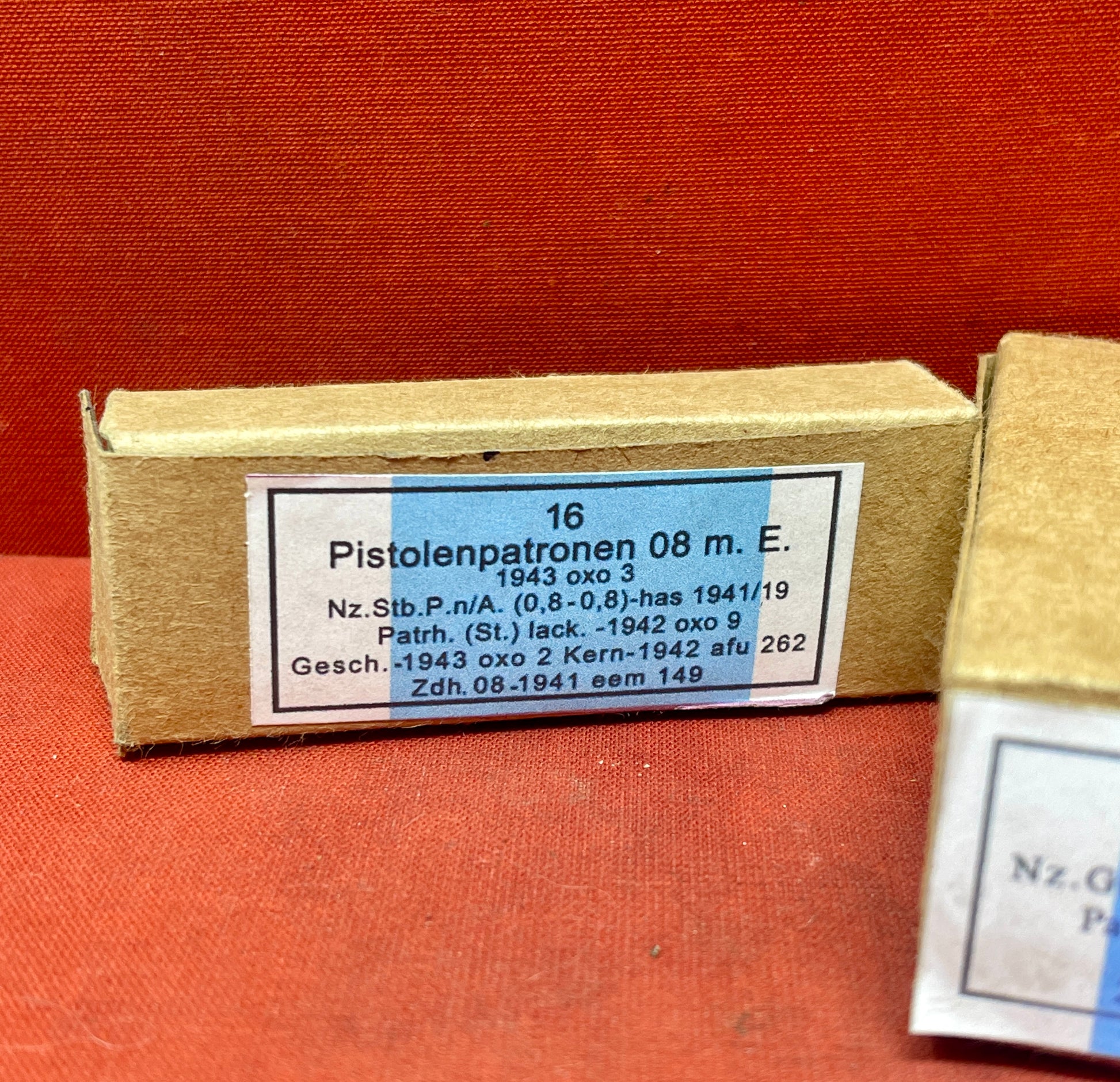 Explore this WWII German Small Arms Ammunition Set, featuring 16 inert 9mm Luger rounds with inert primers and 15 inert 7.92x57mm K98 rounds on three stripper clips. Packaged in handmade replica boxes, this bespoke kit is perfect for collectors and enthusiasts.