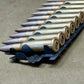 30 × Inert French 8×50mmR Lebel 1948 Rounds on Original 30-Round Hotchkiss Strip – Oil Injected Display Set