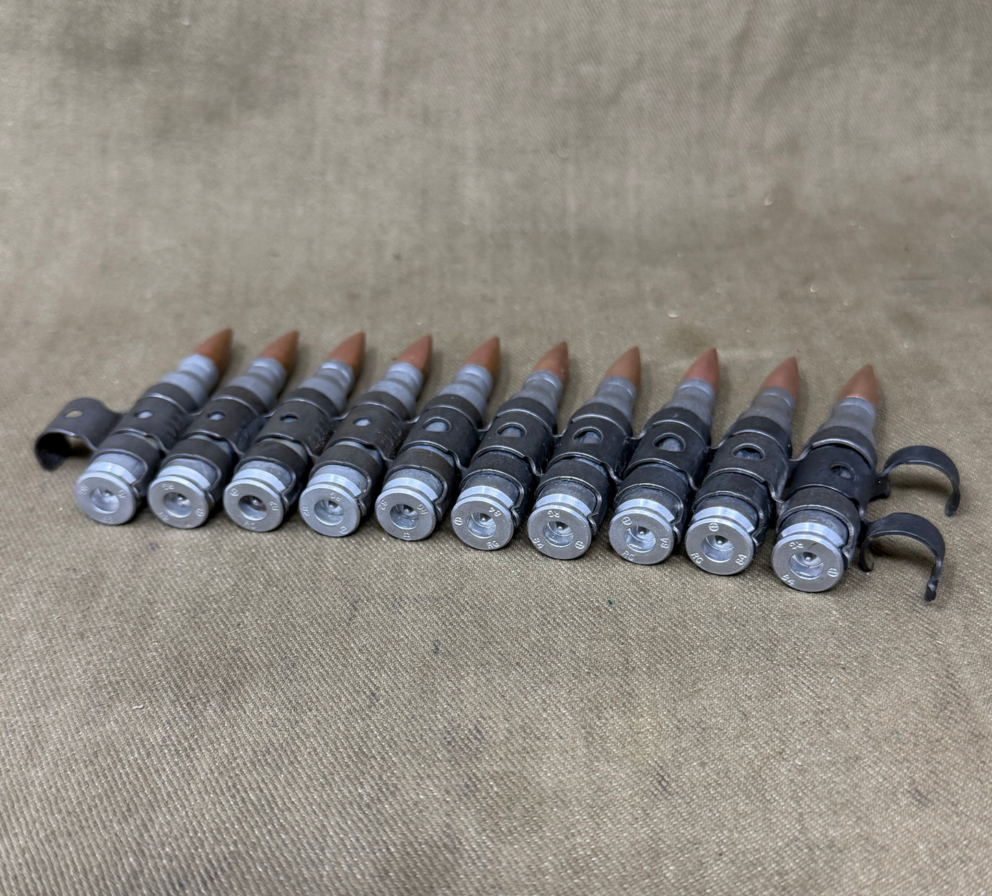 10 x 7.62mm British Military Drill Rounds in GPMG Link Belt – Inert Training Display Set