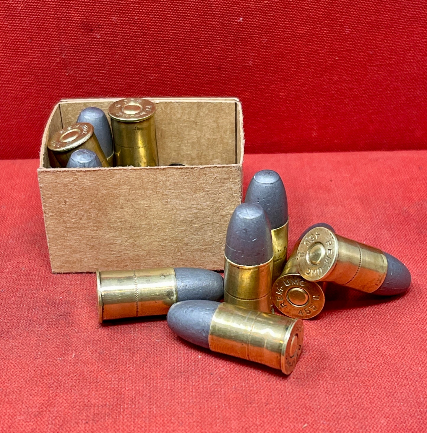 Authentic 12-round reproduction box of British .455 inert/display revolver cartridges. Perfect for collectors, reenactors, and historical displays. Safe & non-functional.