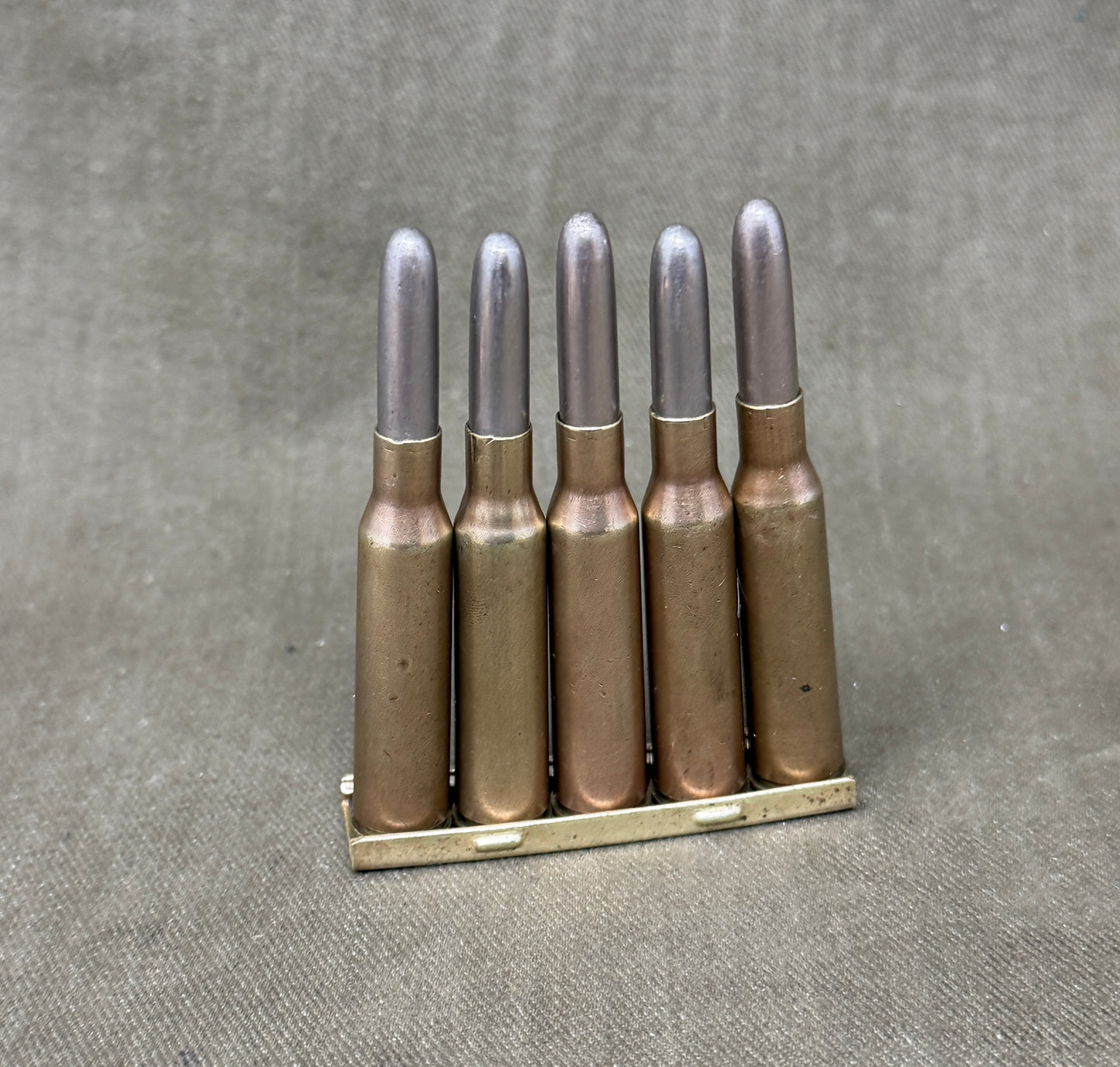 Original Japanese Type 38 Arisaka 6.5mm Inert Rounds on Charger Clip – WW2 / Pre-WW2