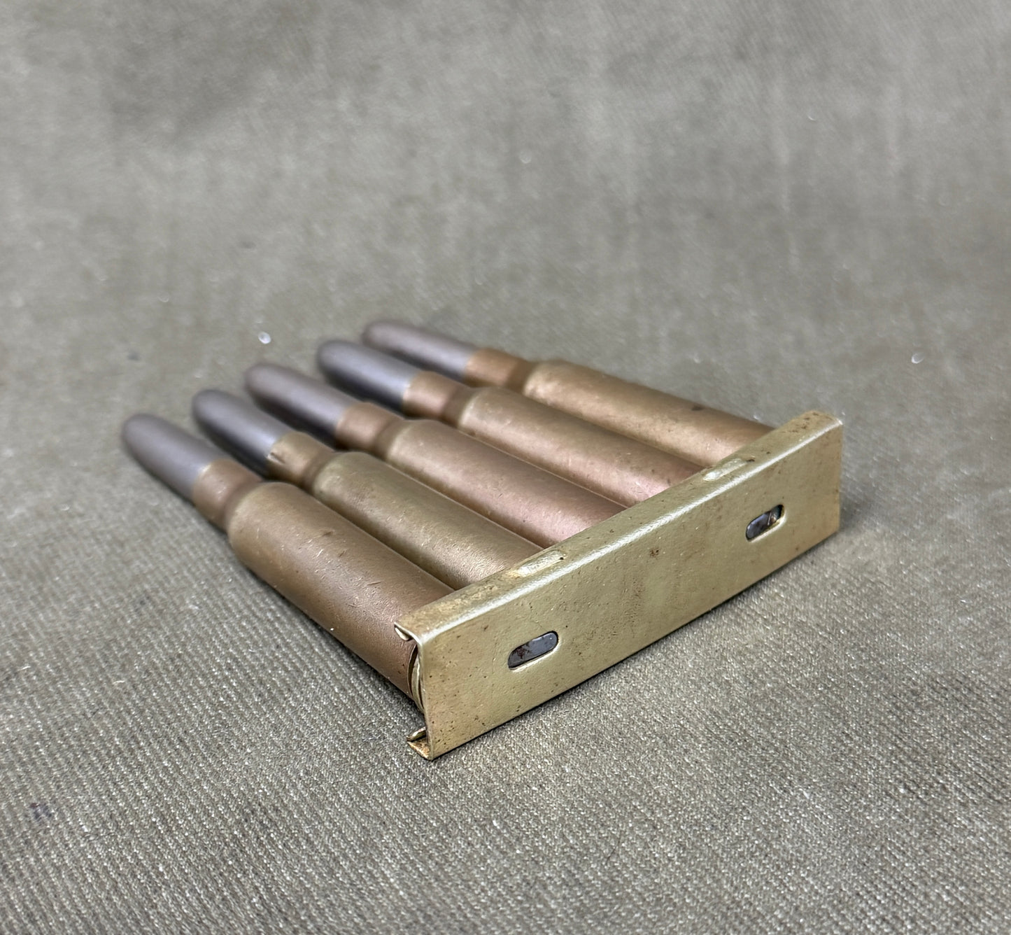 Original Japanese Type 38 Arisaka 6.5mm Inert Rounds on Charger Clip – WW2 / Pre-WW2