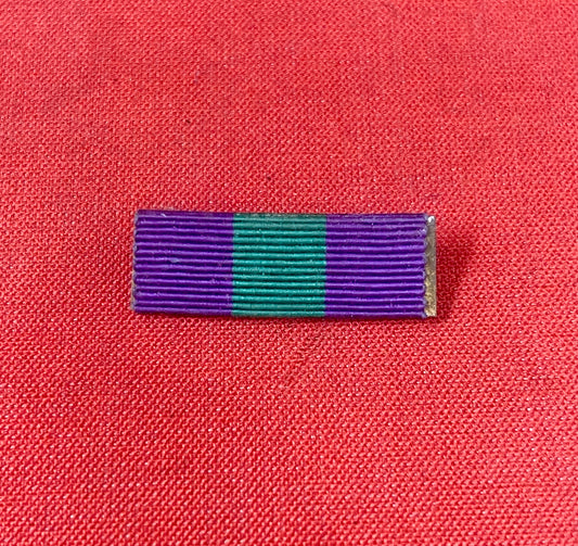 The King George VI General Service Medal (GSM) 1918-1962 ribbon is purple with a central green stripe
