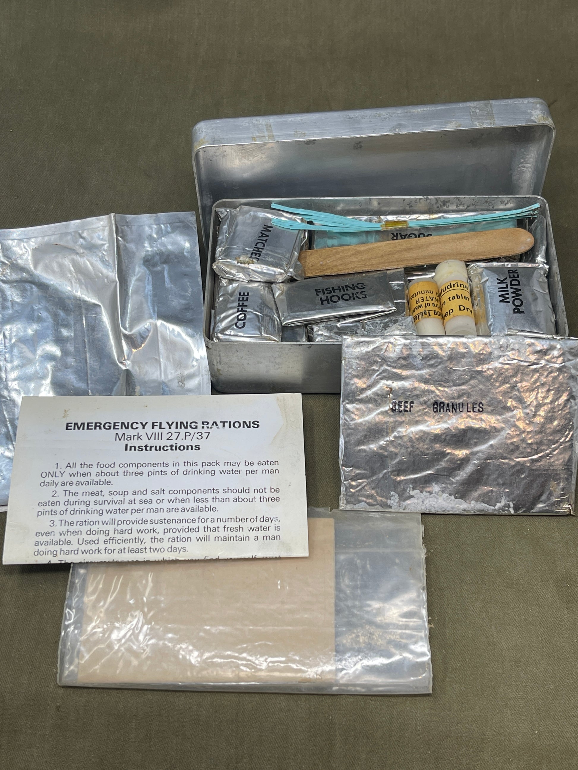 Shop a complete Royal Air Force Mark VIII Emergency Flying Rations tin (27P P.D/74). Rare WW2 survival kit issued to RAF aircrew—perfect for collectors.

