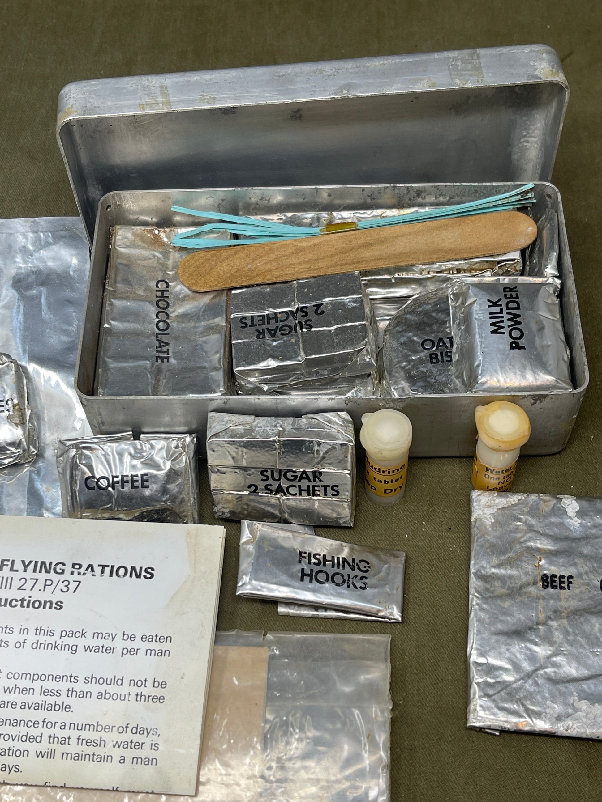 Shop a complete Royal Air Force Mark VIII Emergency Flying Rations tin (27P P.D/74). Rare WW2 survival kit issued to RAF aircrew—perfect for collectors.

