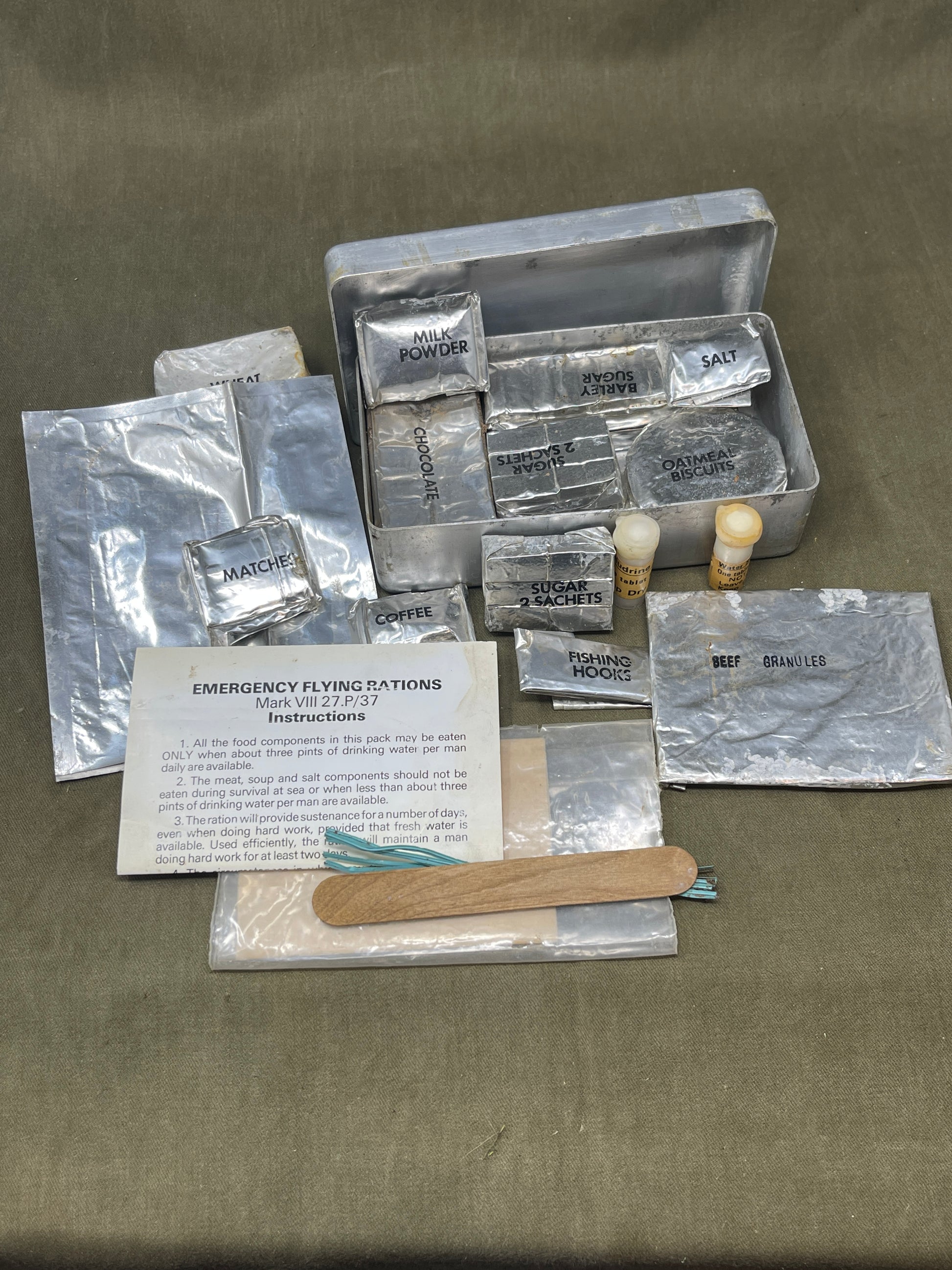 Shop a complete Royal Air Force Mark VIII Emergency Flying Rations tin (27P P.D/74). Rare WW2 survival kit issued to RAF aircrew—perfect for collectors.

