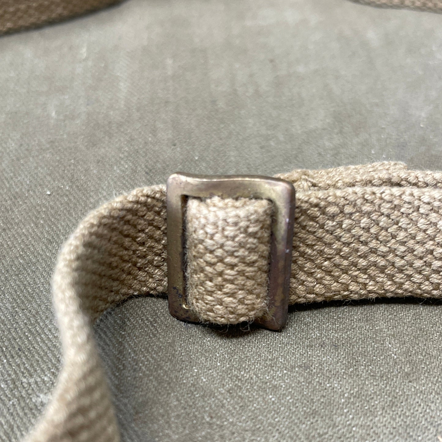 "Authentic British Army WW2 Sten Gun Sling for collectors and reenactors. Durable, adjustable, and historically accurate, perfect for adding a touch of authenticity to your WW2 collection."