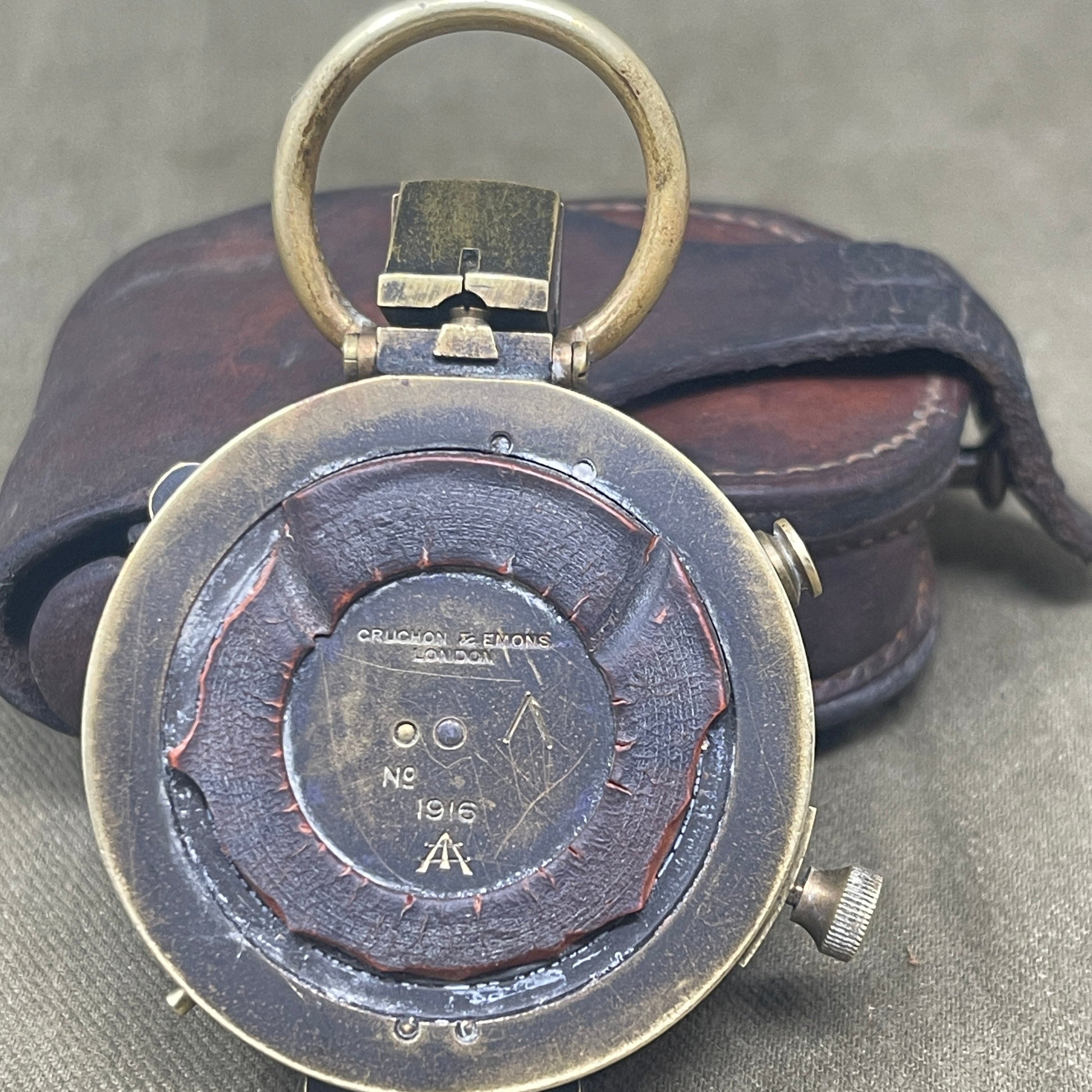 Authentic 1916 British WWI military compass by Cruchon & Emons, London. Excellent condition with original leather case. A rare and collectible Great War navigation instrument.