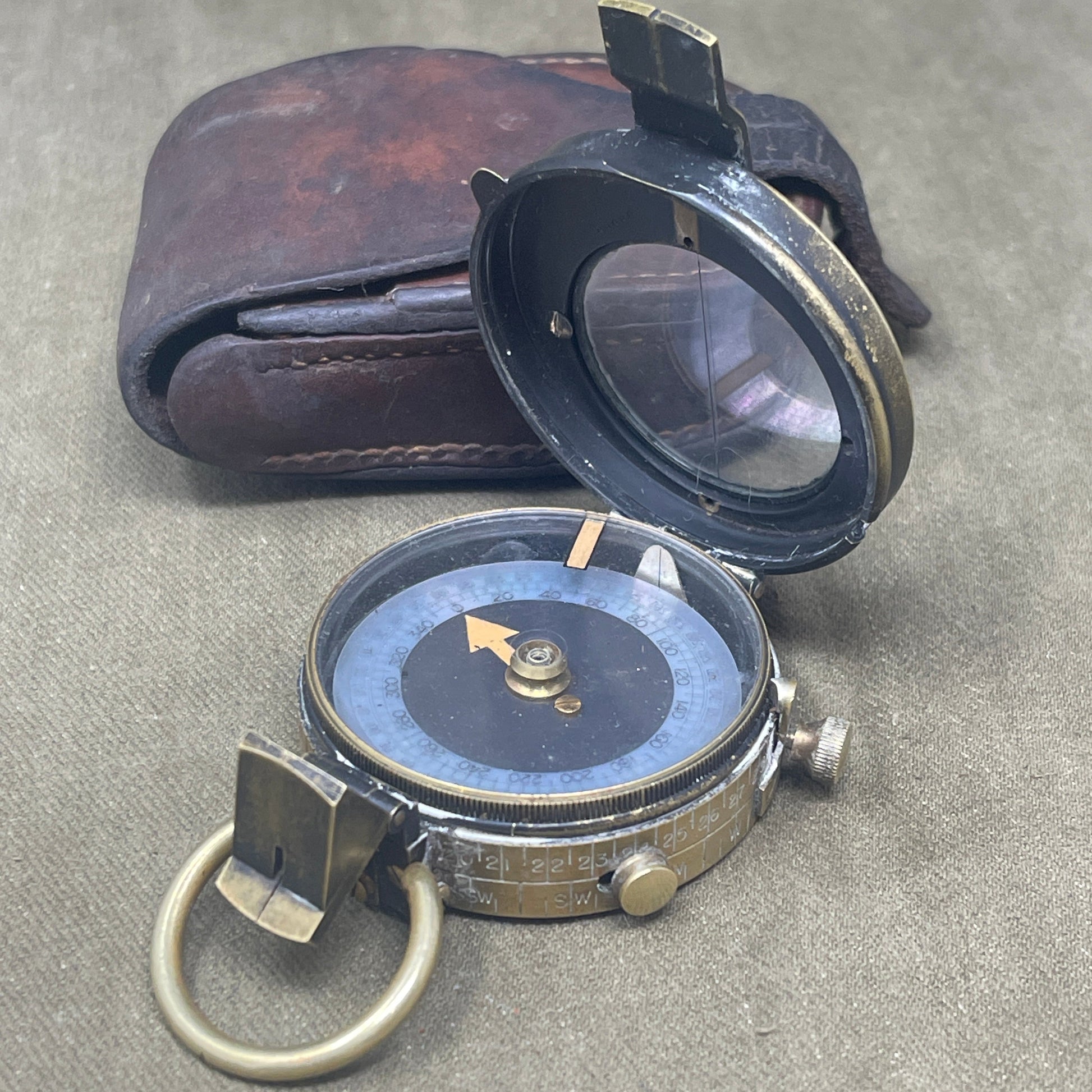 Authentic 1916 British WWI military compass by Cruchon & Emons, London. Excellent condition with original leather case. A rare and collectible Great War navigation instrument.