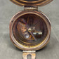 Vintage-style compass on a gray background