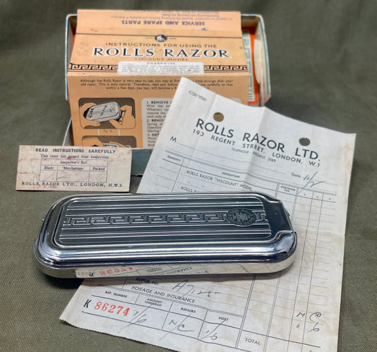 Explore a pristine vintage British Rolls Razor in its original box. This self-sharpening razor is in excellent condition—an ideal piece for collectors and traditional shaving enthusiasts.