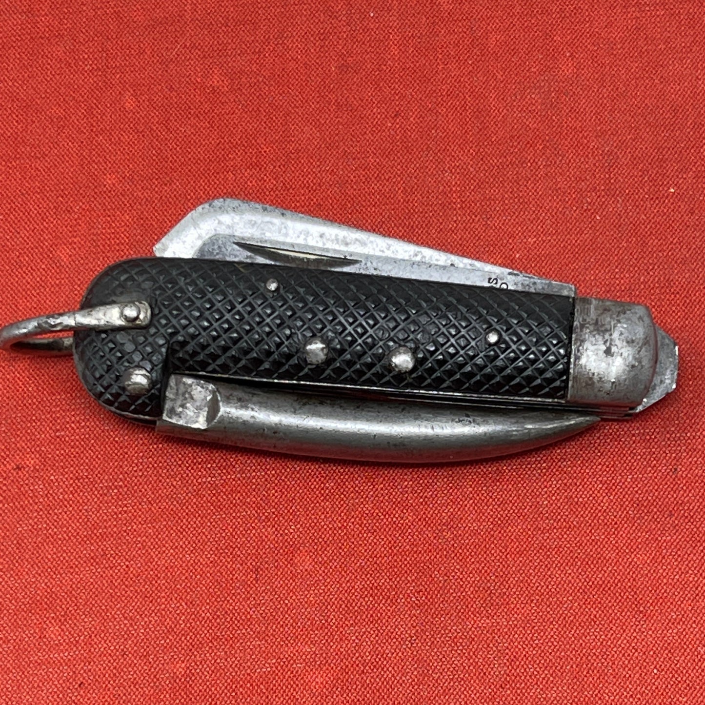 A nice example of a British Jack Knife, Dated 1943 Manufactured in Sheffield by Richards. A genuine antique that is in great condition for its age The blades are in good condition, the chequered Bakelite grip is intact and all the blades lock and close as they should. The steel can opener is in good condition along with the spike. This knife