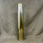 Tall cylindrical metallic object on a textured gray background