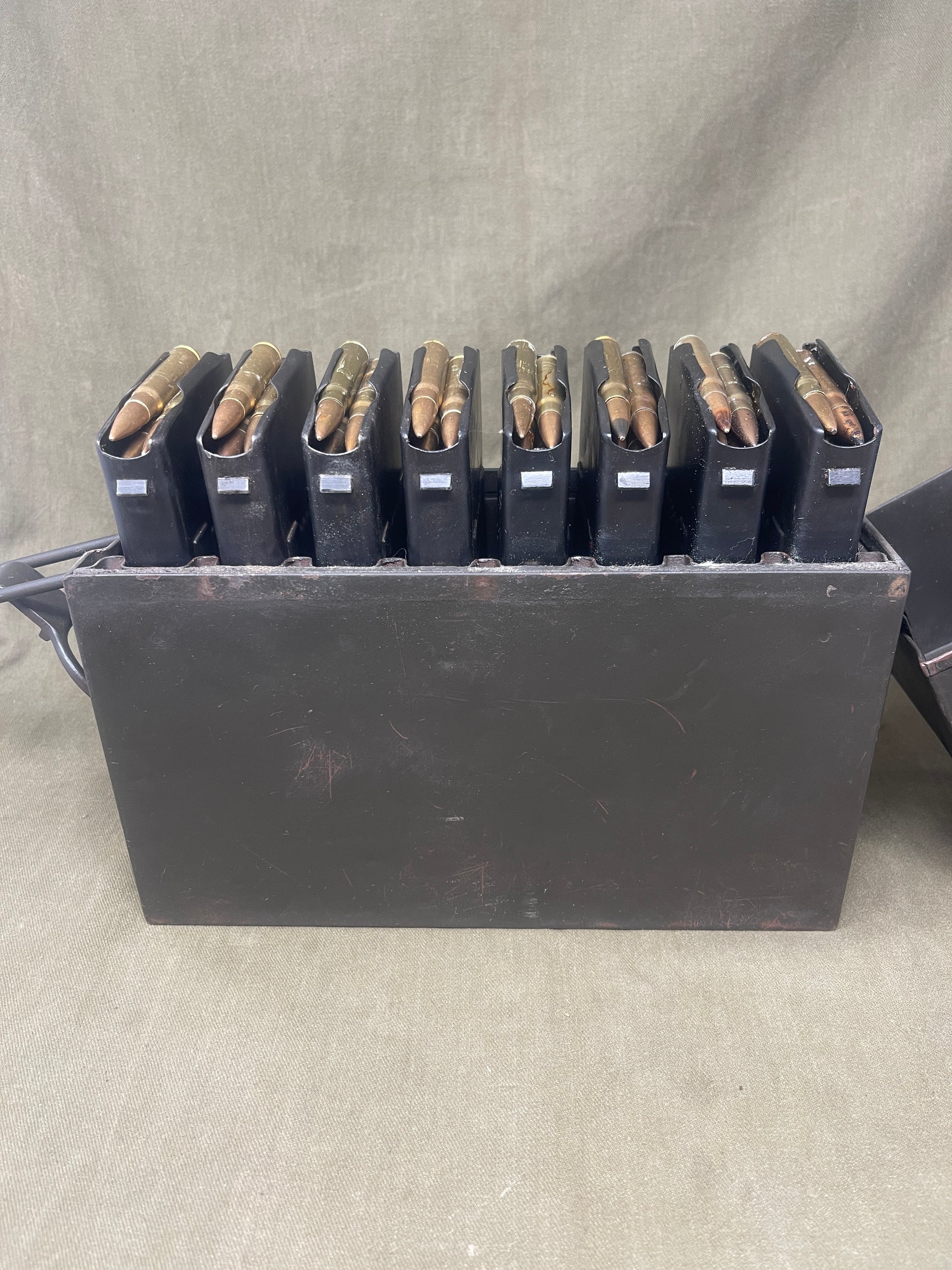 Authentic WW2 German MG13 magazine ammo box with 8 original MG13 magazines and 5 inert 7.92mm rounds. All items stamped with Waffenamt and dates. Excellent condition.