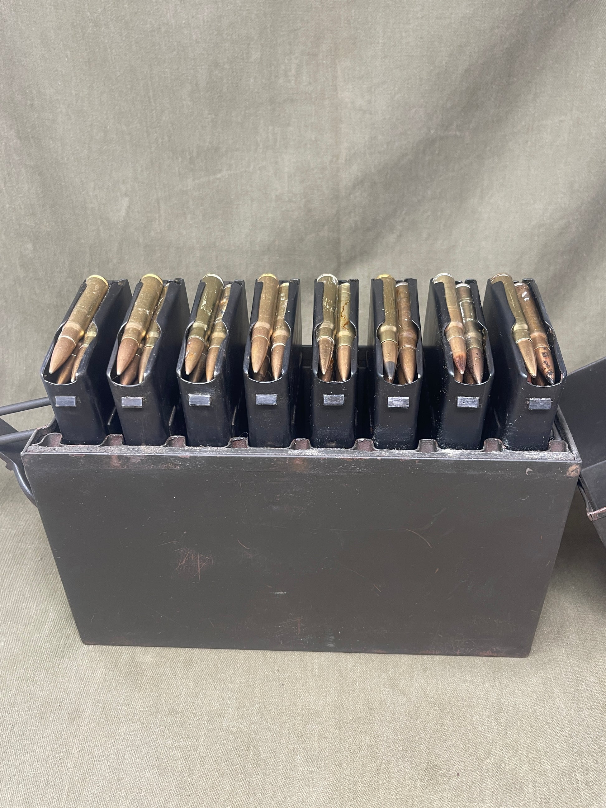 Authentic WW2 German MG13 magazine ammo box with 8 original MG13 magazines and 5 inert 7.92mm rounds. All items stamped with Waffenamt and dates. Excellent condition.
