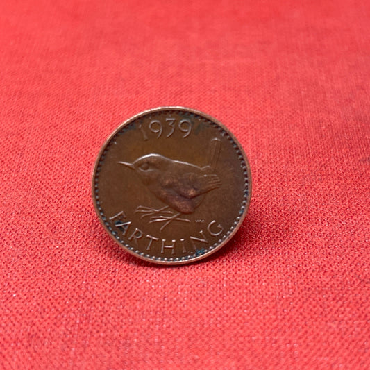 Discover the King George VI Farthing 1940, a historic British coin featuring the iconic wren design. Perfect for collectors and history enthusiasts, this bronze coin reflects the resilience of wartime Britain.