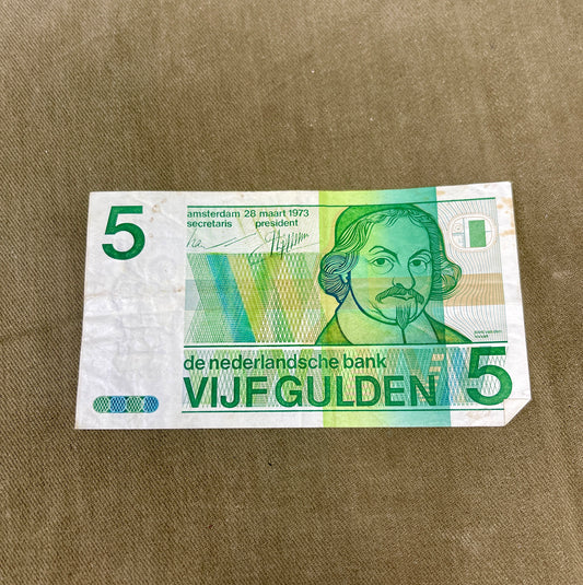 This selection of vintage Dutch Guilder banknotes from the 1960s and 1970s includes denominations of 5, 10, and 25 Gulden, each showcasing distinctive Dutch design and cultural heritage. Issued by De Nederlandsche Bank, these notes feature iconic imagery such as the statue of Erasmus (ƒ5), Baruch Spinoza (ƒ10), and Michiel de Ruyter (ƒ25), reflecting the country’s historical and intellectual legacy. Printed in bold colours and artistic styles, these notes are no longer in circulation, having been replaced b
