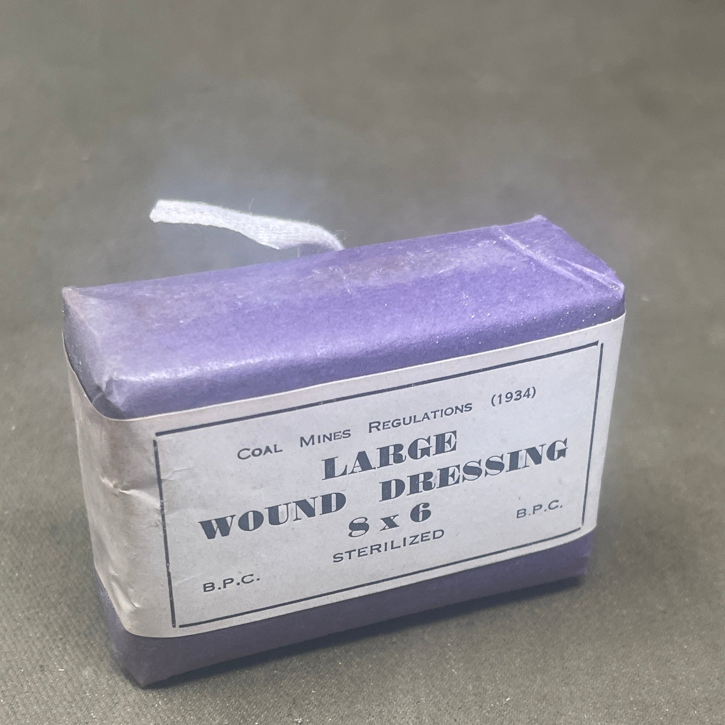 Explore the historical artifact of the WW2 1930s British Home Front ARP Large First Aid Dressing, Mines Type. Delve into its significance in civilian air raid precautions during World War II, showcasing resilience and preparedness amidst wartime challenges.