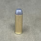 Bullet casing on a gray concrete surface