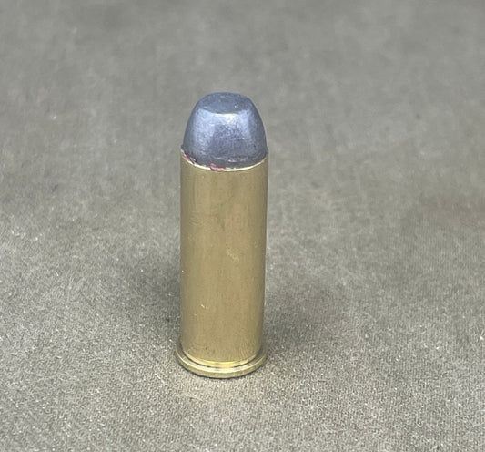Bullet casing on a gray concrete surface