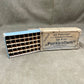 Vintage Parabellum ammunition box with a magazine on a gray background