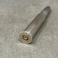Metallic cylindrical object with 'RWS' branding on a gray surface