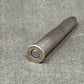 Ammunition casing on a gray surface