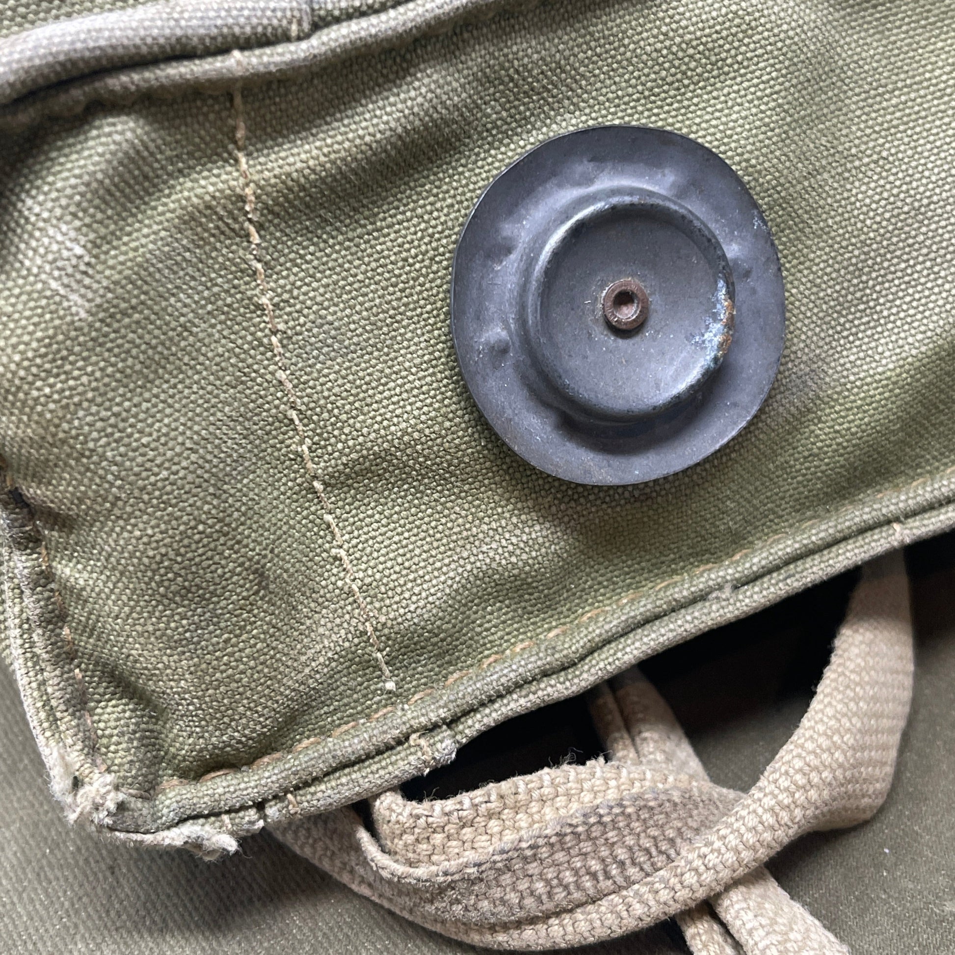 The British WW2 Respirator, Anti-Gas, General Service, Mk V, and Haversack, Mk VI provided essential protection against chemical warfare. The Mk V respirator featured a full-face rubber mask and filter canister, while the Mk VI canvas haversack ensured easy portability and access. Both were crucial for soldier safety during gas attacks