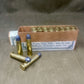 Box of ammunition with cartridges on a textured surface