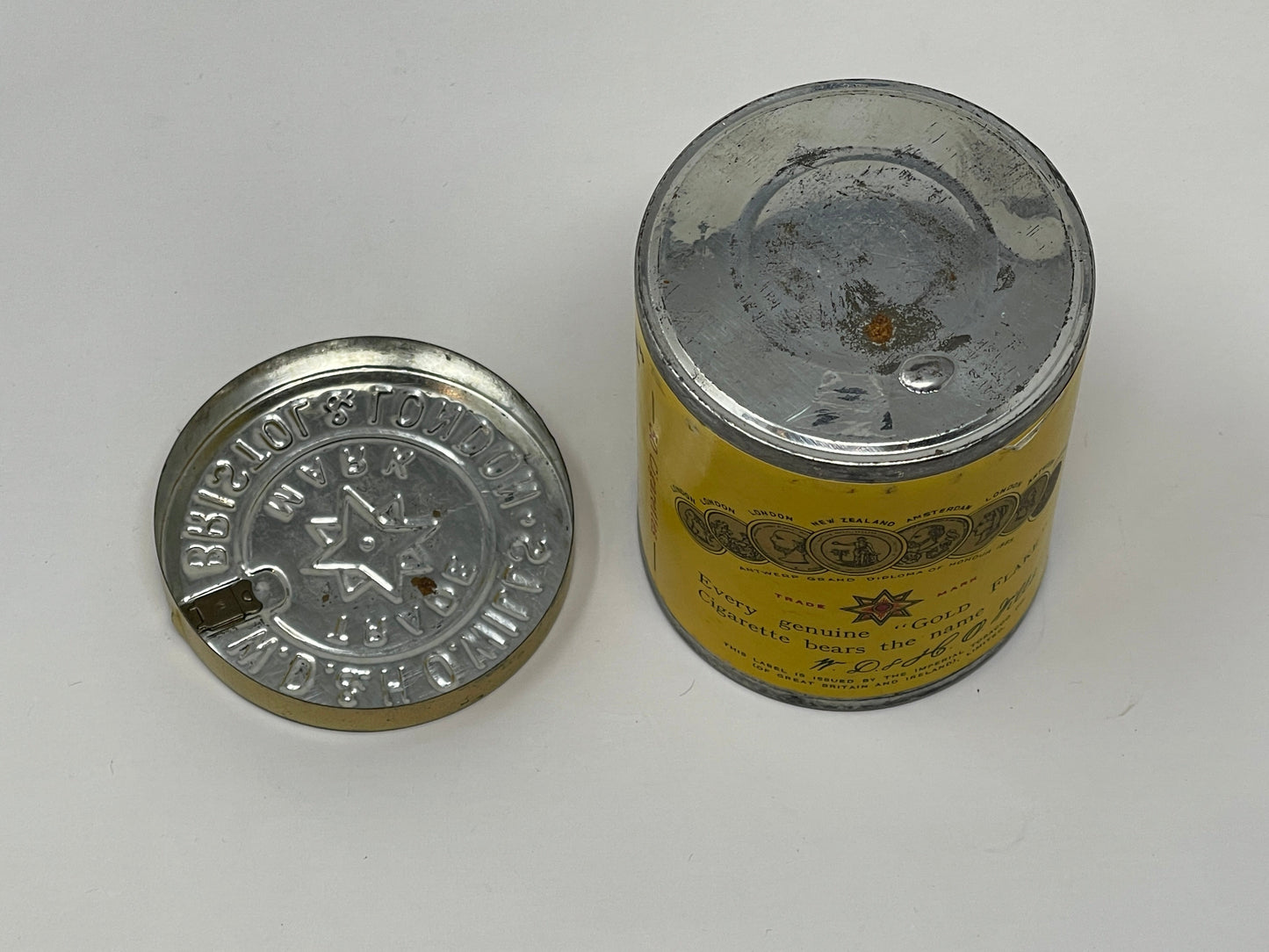 Airtight Sealed Can of 50 Gold Flake Cigarettes lid to the side of tin