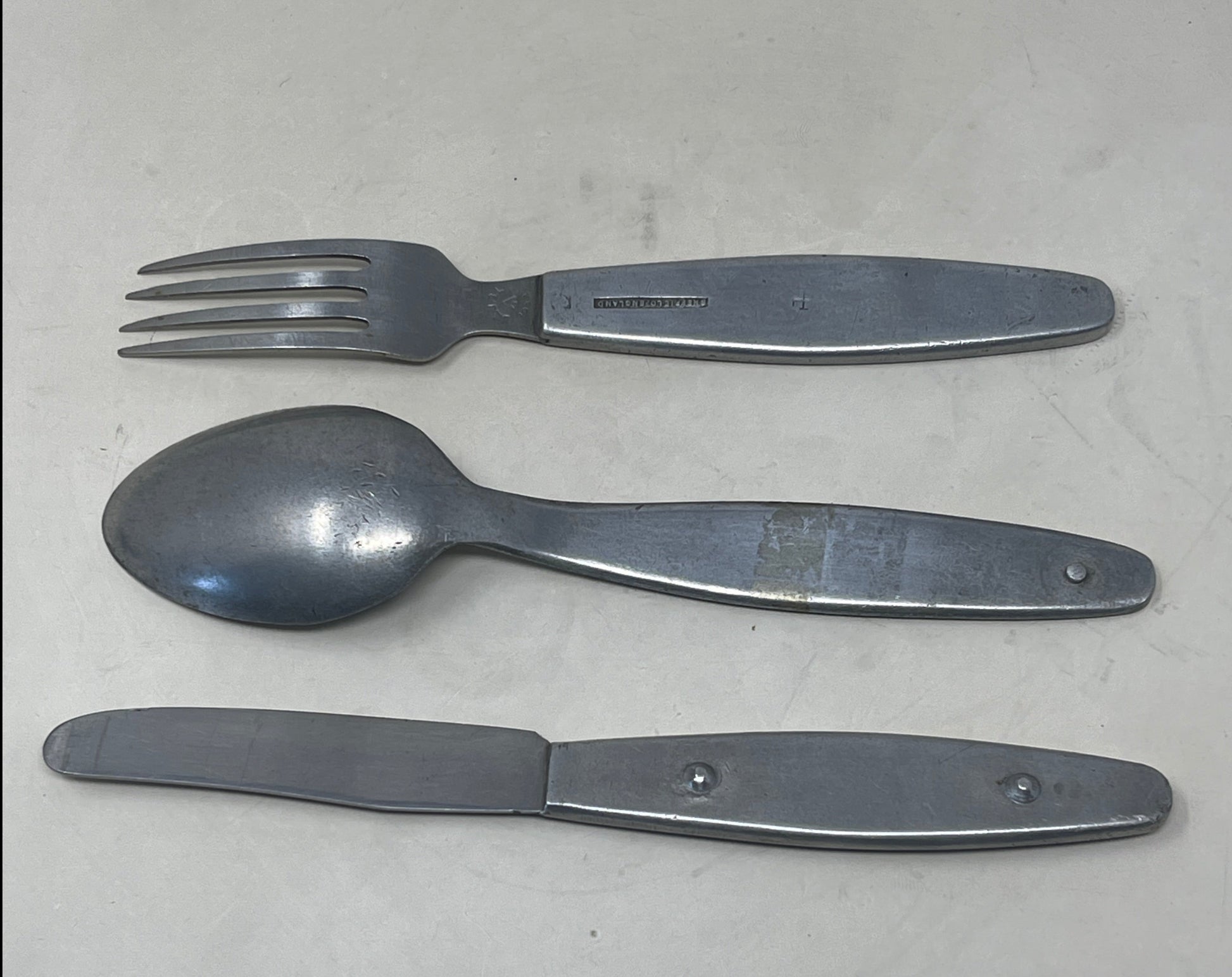 Knife, fork, and spoon set dated 1944